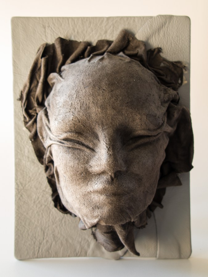 ansigt skind læder skulptur